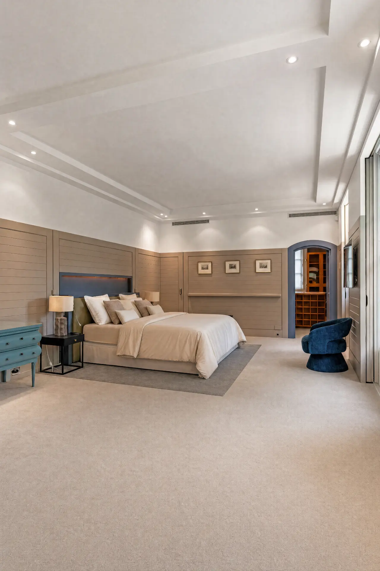 Bedroom wrapped in taupe paneling