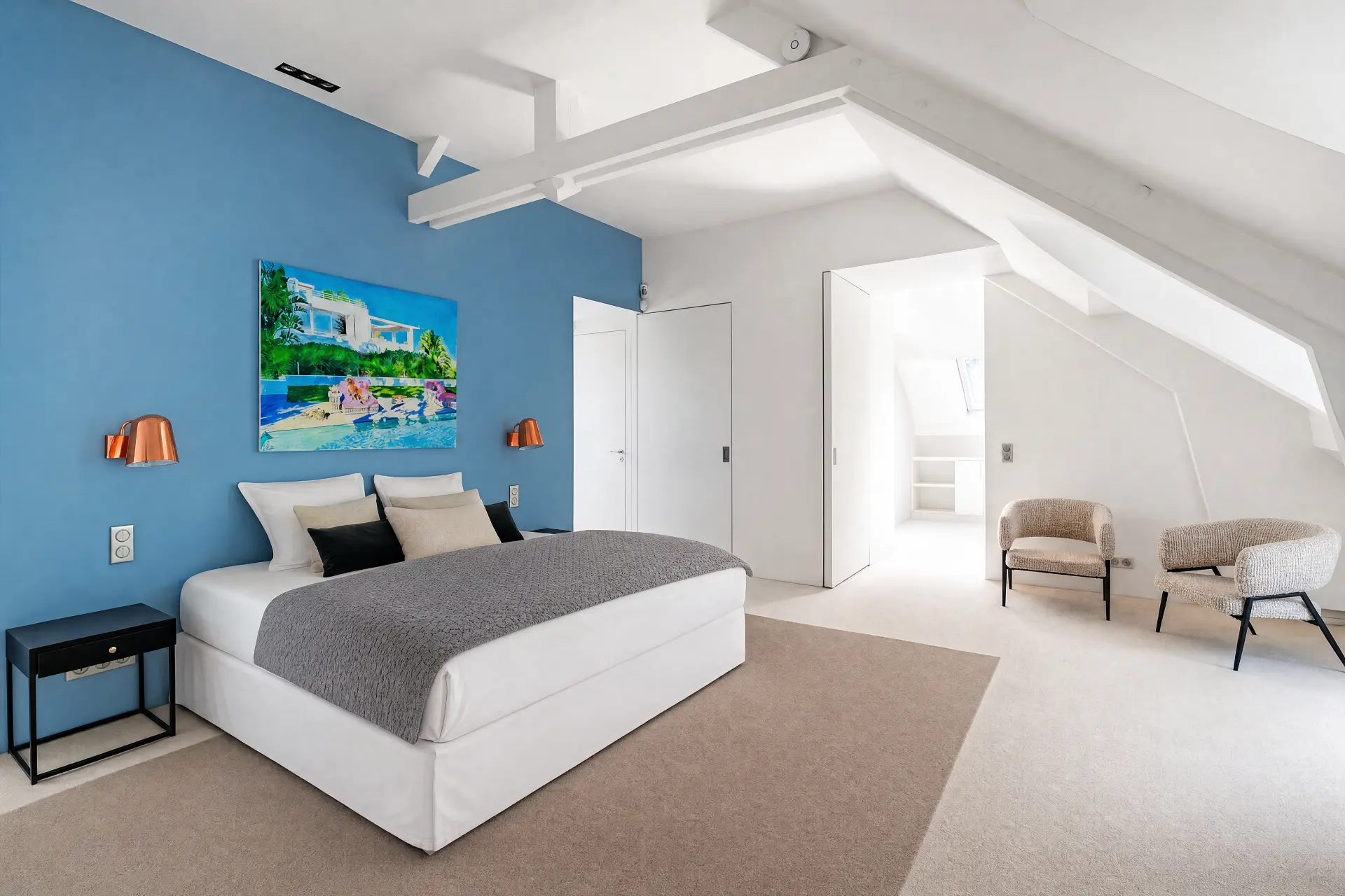 Top-floor bedroom with blue walls under white beams