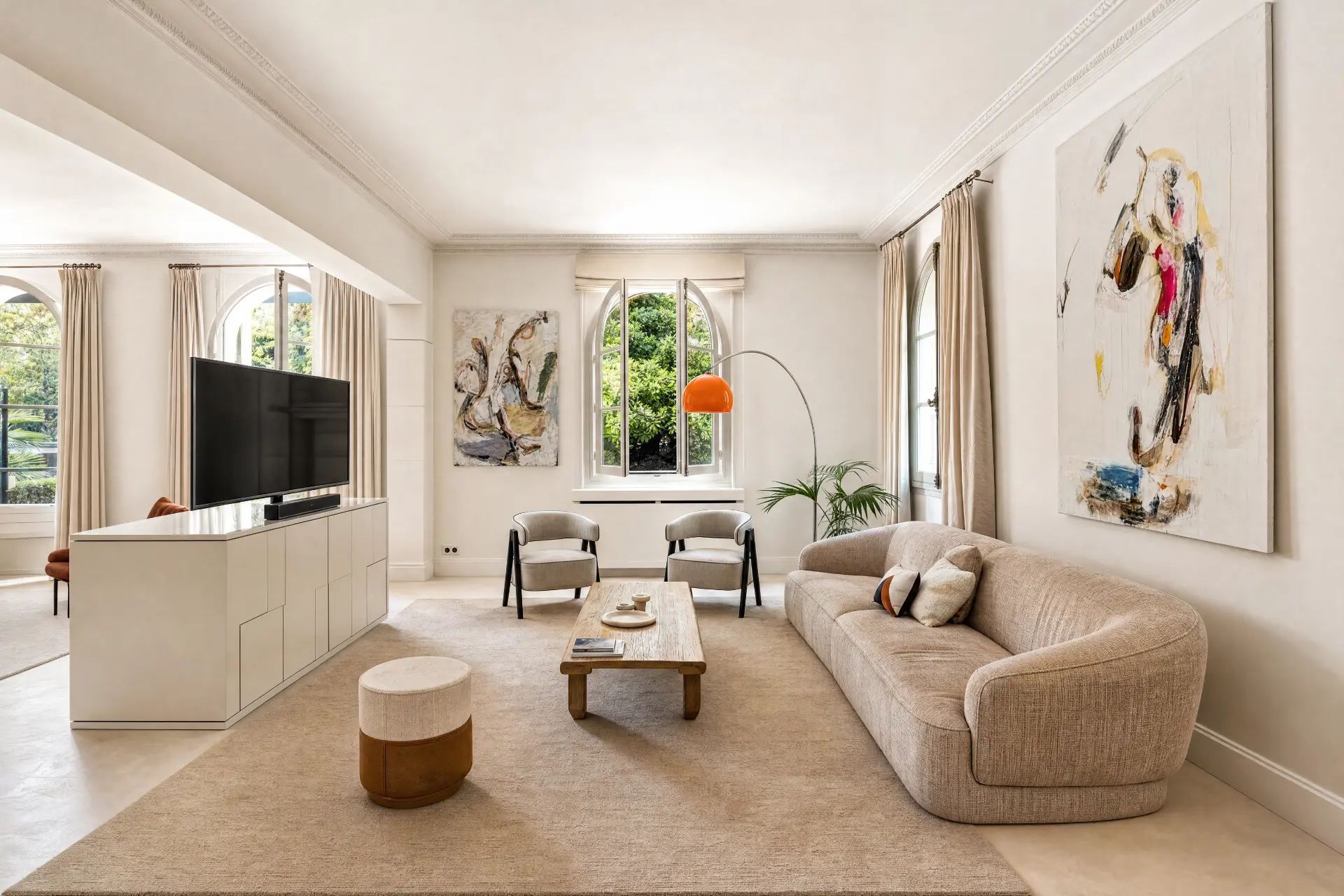 Media room with arched windows onto the trees