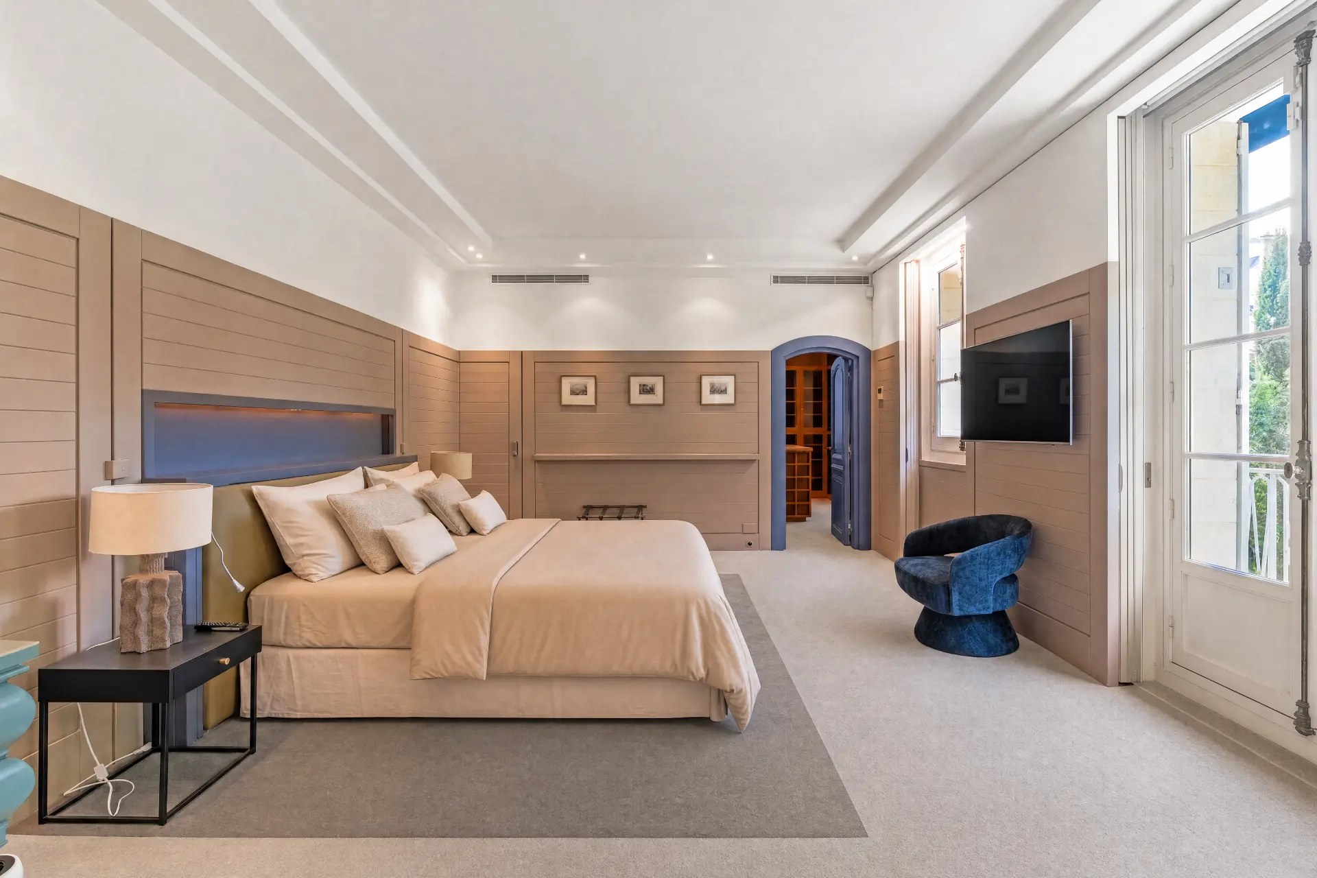 Principal bedroom in pale paneling